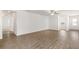 Bright, airy living room featuring wood-look floors and an open layout for comfortable living at 1786 White Elephant Loop, Winter Haven, FL 33884