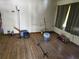 Spacious living room featuring hardwood floors and natural light from a window with curtains at 1122 E Edgewood Dr, Lakeland, FL 33803