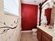 Half bathroom features a modern sink and a unique tree-themed paint job at 15387 Avenue Of The Arbors, Winter Garden, FL 34787