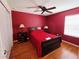 This bedroom features a ceiling fan, wood-look floors, and an accent wall at 15387 Avenue Of The Arbors, Winter Garden, FL 34787