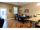 Dining room featuring a chandelier and a wood table with seating for six at 15387 Avenue Of The Arbors, Winter Garden, FL 34787