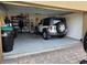Spacious two car garage featuring ample storage and a white Jeep at 15387 Avenue Of The Arbors, Winter Garden, FL 34787