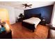 Spacious main bedroom features hardwood floors, ceiling fan, and adjoining room at 15387 Avenue Of The Arbors, Winter Garden, FL 34787