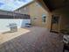 Covered patio featuring brick pavers, grill, and access to the house at 15387 Avenue Of The Arbors, Winter Garden, FL 34787