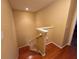 A view looking down the staircase with wood steps and white railing in a home interior at 15387 Avenue Of The Arbors, Winter Garden, FL 34787