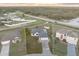An aerial view of the home shows its positioning on a large lot with well-maintained landscaping at 25 Inconnu Dr, Kissimmee, FL 34759