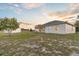 This home has a large back yard with a storage shed and a covered back porch at 25 Inconnu Dr, Kissimmee, FL 34759
