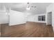 Open-concept living area boasts wood-look vinyl flooring and a ceiling fan for added comfort at 25 Inconnu Dr, Kissimmee, FL 34759