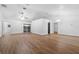 Spacious living room with vaulted ceilings and wood-look vinyl flooring throughout at 25 Inconnu Dr, Kissimmee, FL 34759