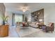 Stylish living room features modern decor, hardwood floors, and a ceiling fan at 4117 Jespersen St, Apopka, FL 32712