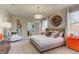 Serene main bedroom with neutral tones, a large bed, and modern furnishings at 4117 Jespersen St, Apopka, FL 32712