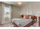 Cozy main bedroom with neutral decor, plush carpet, and a comfortable bed at 4117 Jespersen St, Apopka, FL 32712