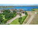 A beautiful waterfront property with a large home, lush landscaping, and lake views at 7769 Summerlake Pointe Blvd, Winter Garden, FL 34787