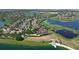 An aerial view of waterfront homes showcases community lakes surrounded by lush landscapes and scenic vistas at 7769 Summerlake Pointe Blvd, Winter Garden, FL 34787