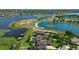 Waterfront homes with boat docks and lovely landscaped yards offer views of the serene lake at 7769 Summerlake Pointe Blvd, Winter Garden, FL 34787