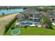 A swimming pool, hot tub, and lounge chairs on a stone paver patio offer outdoor relaxation at 7769 Summerlake Pointe Blvd, Winter Garden, FL 34787