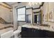 The bathroom features a granite countertop, decorative tile, and tiled shower and bath combo at 7769 Summerlake Pointe Blvd, Winter Garden, FL 34787