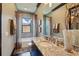 Relaxing bathroom features a tub and shower combo, large vanity, and modern finishes at 7769 Summerlake Pointe Blvd, Winter Garden, FL 34787