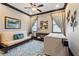 Flex bedroom featuring two windows, a futon, and a comfortable area rug at 7769 Summerlake Pointe Blvd, Winter Garden, FL 34787