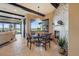 Cozy dining room with a round table, four chairs, and a charming tiled fireplace, perfect for Gathering gatherings at 7769 Summerlake Pointe Blvd, Winter Garden, FL 34787