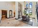 A formal dining room with high ceilings and natural light, features an adjacent butler's pantry at 7769 Summerlake Pointe Blvd, Winter Garden, FL 34787
