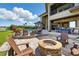 Stunning backyard features a fire pit, pool, and outdoor seating areas at 7769 Summerlake Pointe Blvd, Winter Garden, FL 34787