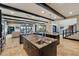 Open kitchen featuring granite countertops, dark wood cabinets, and stainless steel appliances overlooking the living area at 7769 Summerlake Pointe Blvd, Winter Garden, FL 34787