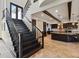 An open concept kitchen features a large staircase and connects to the living spaces at 7769 Summerlake Pointe Blvd, Winter Garden, FL 34787