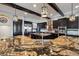 A kitchen with granite countertops, stainless appliances, and a functional center island at 7769 Summerlake Pointe Blvd, Winter Garden, FL 34787