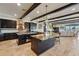 This open kitchen features stone countertops, a central island, and stainless steel appliances at 7769 Summerlake Pointe Blvd, Winter Garden, FL 34787