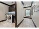 Convenient laundry room with tile floors, granite countertops, and modern appliances at 7769 Summerlake Pointe Blvd, Winter Garden, FL 34787