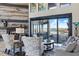An open living room features a decorative fireplace and sliding glass doors to the outdoor living space at 7769 Summerlake Pointe Blvd, Winter Garden, FL 34787