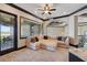 Cozy living room features a large picture window and a comfortable sectional sofa, perfect for relaxing at 7769 Summerlake Pointe Blvd, Winter Garden, FL 34787