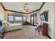 Spacious main bedroom featuring a waterfront view, balcony access, and a dedicated workspace at 7769 Summerlake Pointe Blvd, Winter Garden, FL 34787