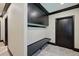 Well-appointed mud room with custom built-ins, tile flooring, and a convenient bench at 7769 Summerlake Pointe Blvd, Winter Garden, FL 34787
