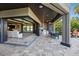 Expansive outdoor patio with a built-in kitchen and scenic views, perfect for dining and entertaining in style at 7769 Summerlake Pointe Blvd, Winter Garden, FL 34787