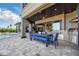 Covered patio showcases an outdoor kitchen, dining space, and views of the pool at 7769 Summerlake Pointe Blvd, Winter Garden, FL 34787