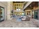 Entertain on the beautiful covered patio with stone fireplace and plenty of space for guests at 7769 Summerlake Pointe Blvd, Winter Garden, FL 34787
