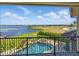 The patio overlooks a beautiful pool, lush landscaping, and a scenic lake at 7769 Summerlake Pointe Blvd, Winter Garden, FL 34787