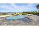 Inviting swimming pool with spa, waterfall features, and waterfront views at 7769 Summerlake Pointe Blvd, Winter Garden, FL 34787