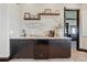 Entertainment area features a wet bar with ample storage, granite countertops, and decorative accents at 7769 Summerlake Pointe Blvd, Winter Garden, FL 34787