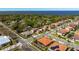 Aerial shot showcases the real estate location, complete with barrel tile roof and mature trees at 108 Stanton Estates Cir, Winter Garden, FL 34787