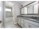 Bright bathroom features double vanities, granite countertops, and a separate tub and shower at 108 Stanton Estates Cir, Winter Garden, FL 34787