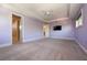 Large carpeted bedroom featuring a ceiling fan, recessed lights, and mounted TV at 108 Stanton Estates Cir, Winter Garden, FL 34787