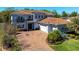 Beautiful two-story home with barrel tile roof, three-car garage, and meticulously landscaped front yard at 108 Stanton Estates Cir, Winter Garden, FL 34787