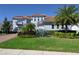 Beautiful two-story home with a tile roof, well-manicured landscaping, and lush green lawn at 108 Stanton Estates Cir, Winter Garden, FL 34787