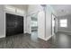 Spacious foyer featuring dark wood double doors and modern sliding barn doors with gray floors at 108 Stanton Estates Cir, Winter Garden, FL 34787