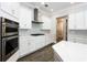 Well-equipped kitchen featuring stainless steel appliances, gas range, and sleek white cabinetry at 108 Stanton Estates Cir, Winter Garden, FL 34787