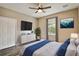 Inviting bedroom with a cozy bed, natural light, and modern decor for a relaxing atmosphere at 130 Southern Pecan Cir # 205, Winter Garden, FL 34787