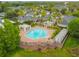 Overhead view of a community pool with lounge chairs, pergolas, and mature palm trees at 130 Southern Pecan Cir # 205, Winter Garden, FL 34787